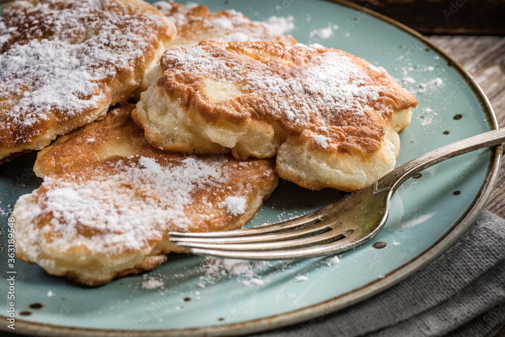 Homemade pancakes on a wooden table.