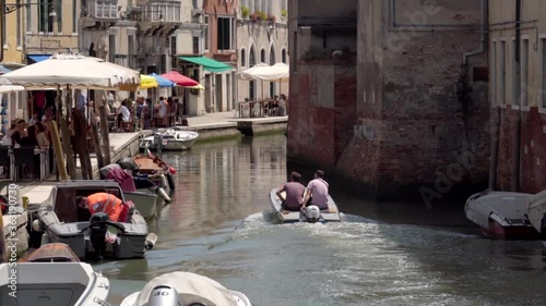 Wallpaper Mural Two men in a boat sail in canal. Venice Italy Torontodigital.ca
