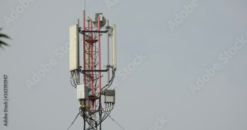 Close-up shot of Telecommunication tower. Telecom tower antennas and satellite transmits the signals of cellular 5g 4g mobile signals to the consumers and smartphones. 4k. 23.98 fps