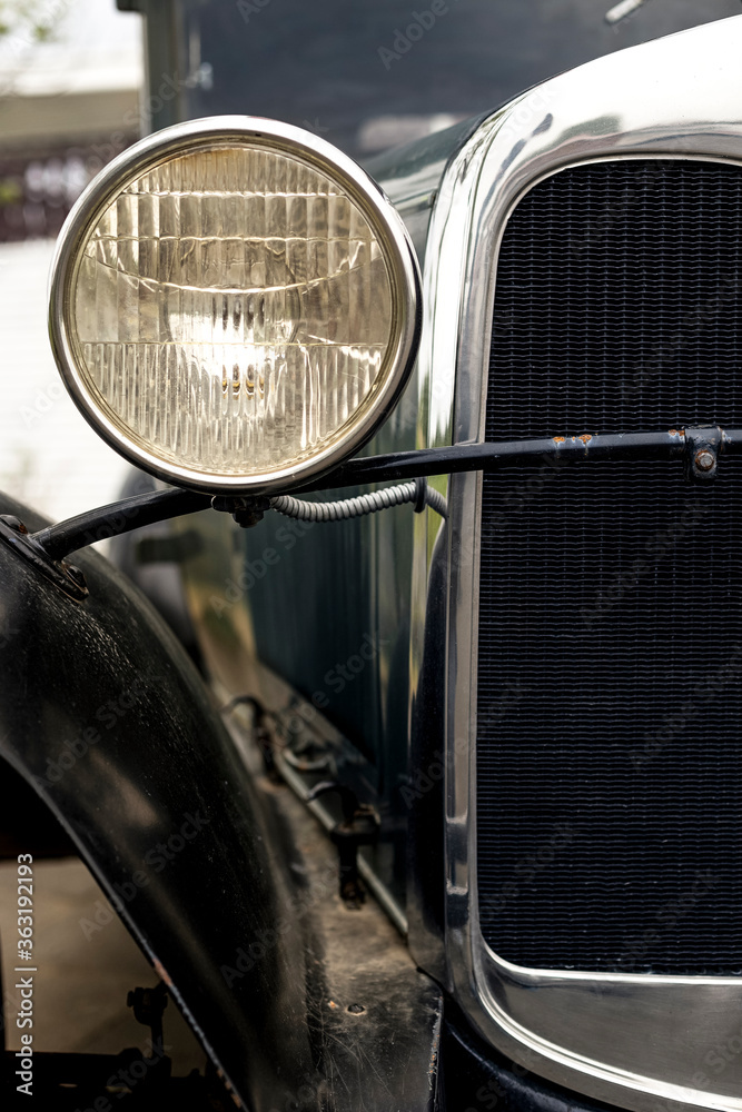 Round headlight of an old classic car