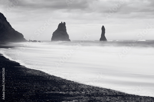 Reynisfjara beach landscape in Vik, Iceland whit Reynisdrangur in the backgrond. Black and white composition. 