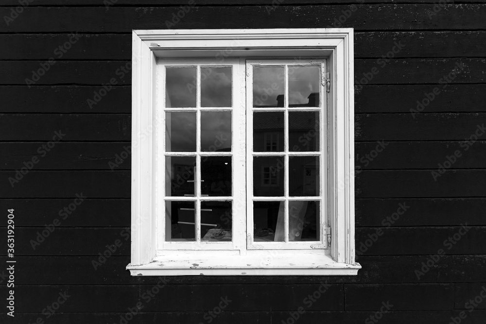 White window on black facade