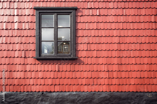Window on red tile roof