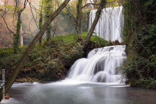 Two waterfalls in an autumnal forest