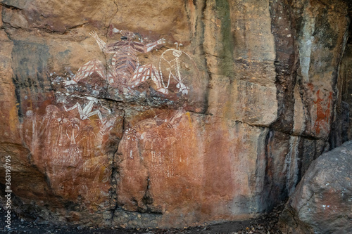 Aboriginal art. Anbangbang gallery. Paintings on a rock wall made with ochre. Sacred site. Meaning: aboriginal dreams. Kakadu national park, Northern Territory NT, Australia photo