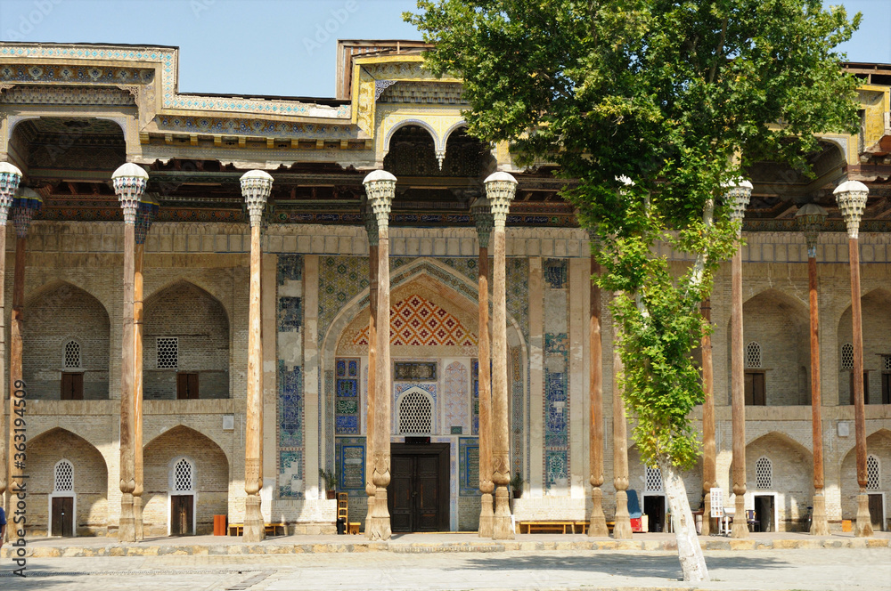 Bolo Pool Mosque was built in 1712. The handcrafted decorations of the mosque made of wood are famous. There is a large pool in front of the mosque. Bukhara, Uzbekistan. 