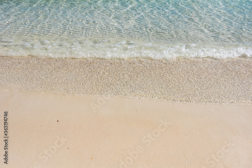 Fototapeta Naklejka Na Ścianę i Meble -  Beach and sea background, Sand and bubble, wave. Soft wave on sandy beach. Background.