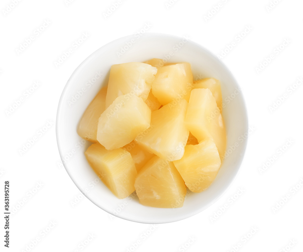 Pieces of delicious canned pineapple in bowl on white background, top view Pieces of delicious canned pineapple in bowl on white background, top view