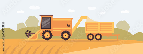 Combine harvester on farm field collecting grain harvest