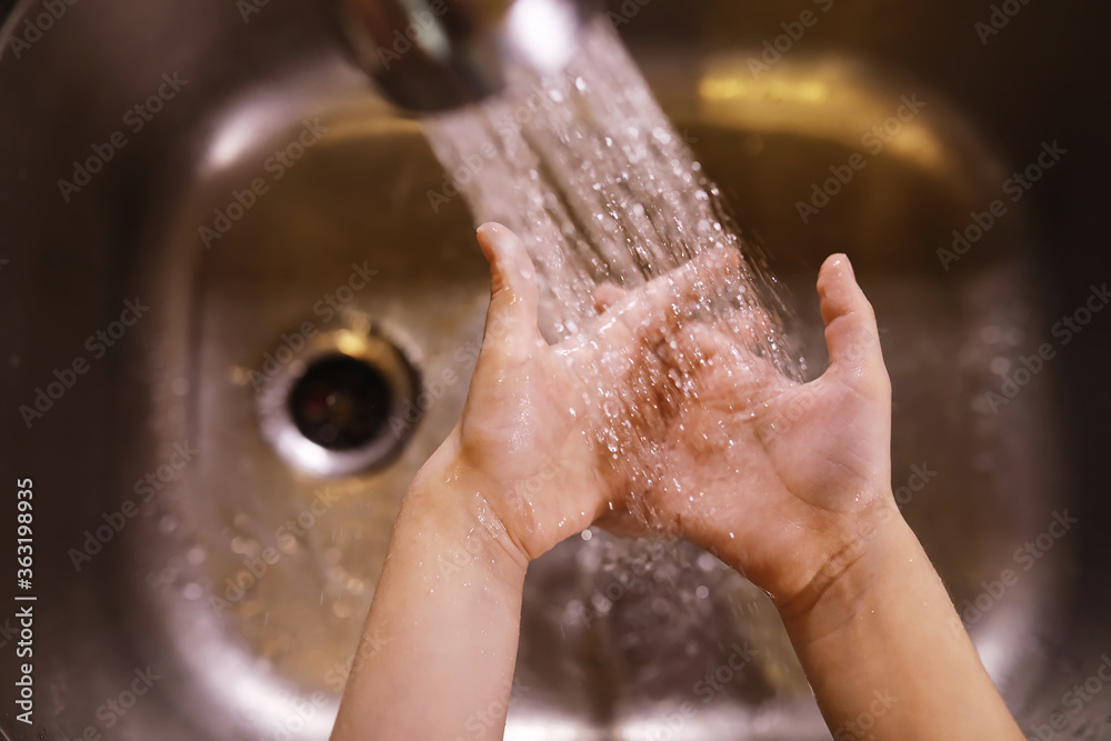 Fototapeta premium Hygiene rules. Hand washing before meals. Antibacterial treatment of hands with soap. A way to prevent virus infection. Coronavirus protection.
