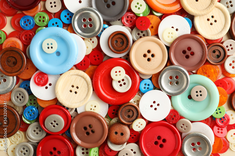 Many plastic sewing buttons as background, closeup