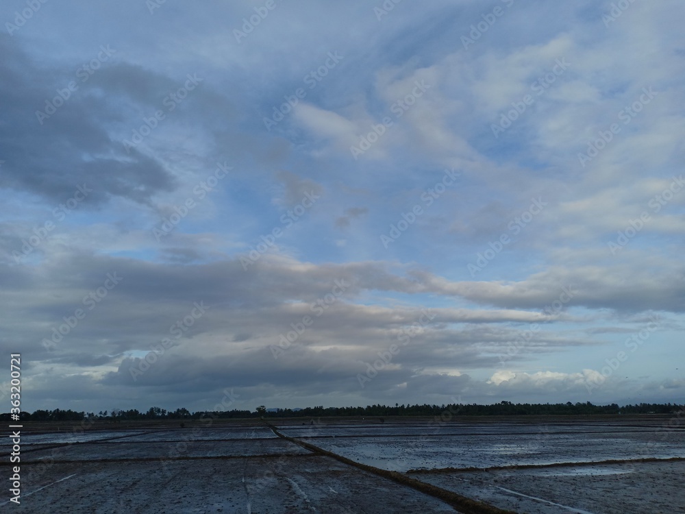 white clouds against a blue sky background