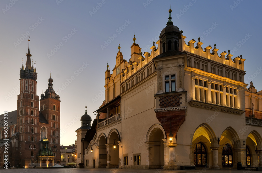 St Mary's Basilica and the Cloth Hall Building in Krakow Poland at dawn.
