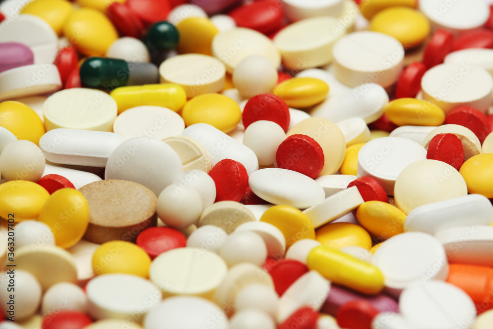 Different colorful tablets at white background Different colorful tablets at white background