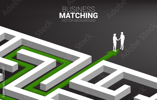 Silhouette of businessman handshake at exit from maze. Concept of business matching. Team work partnership and cooperation.