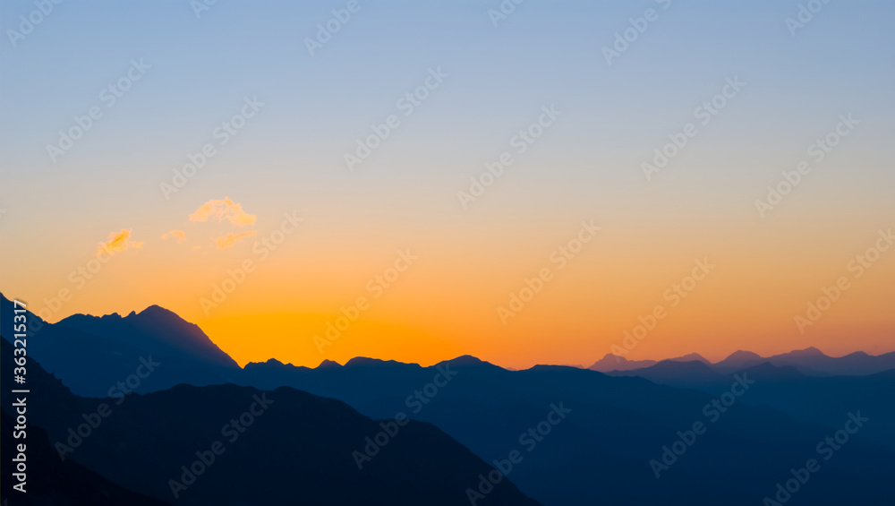 mountain chain silhouette at the sunset, twilight mountain landscape