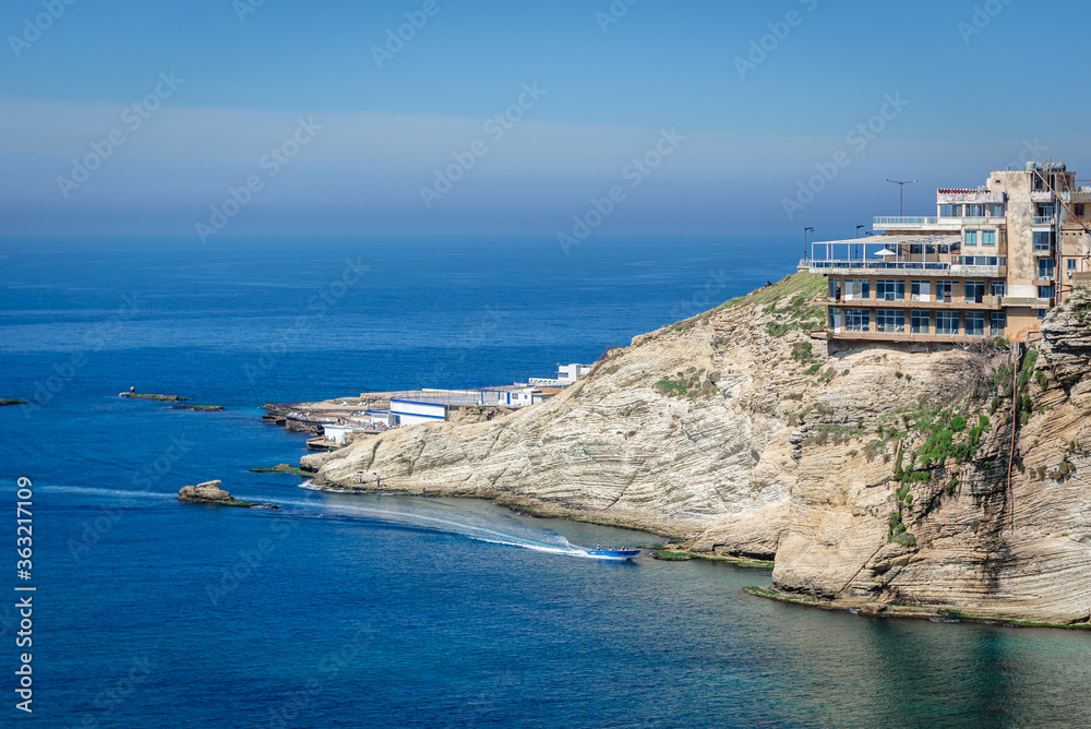 Fototapeta premium Coastline seen from General De Gaulle street next to famous so called Pigeon Rock in Beirut, capital city of Lebanon