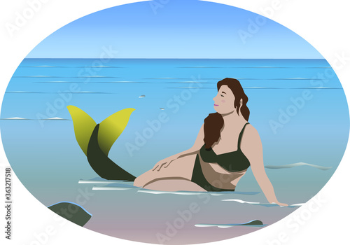 Girl in the sea dreams of becoming a mermaid - she is happy and has a tail