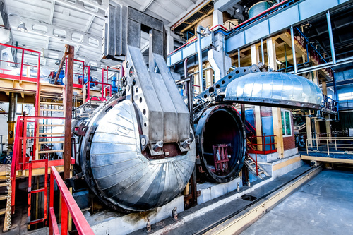 industrial equipment at the factory in large production hall