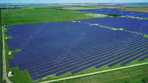 anoramic view of a solar power plant, rows of solar panels, solar panels, top view, Aerial view to solar power plant, Industrial background on renewable resources theme, power station, top view, photo