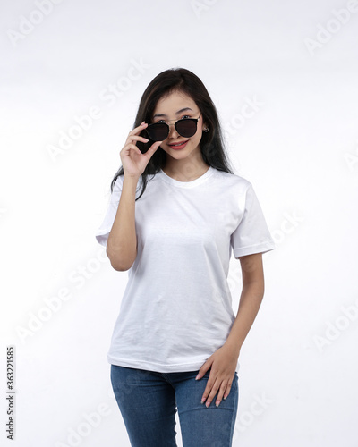 Front view white t-shirt Closeup on female body, woman girl in empty white t-shirt isolated on white background. Design woman t-shirt template and mockup for print.