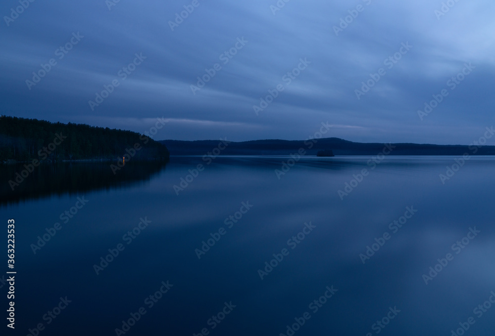 beautiful clouds during blue hour over the lake