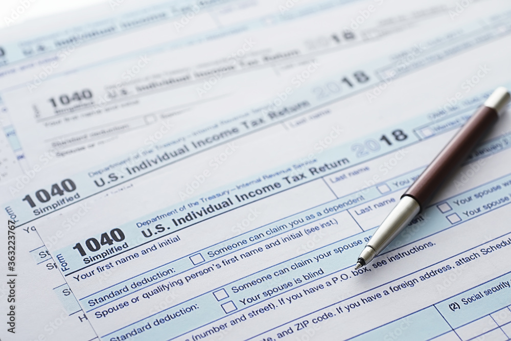 Annual tax reporting. Tax form on the table. Financial statements for signature. Annual tax reporting. Tax form on the table. Financial statements for signature.