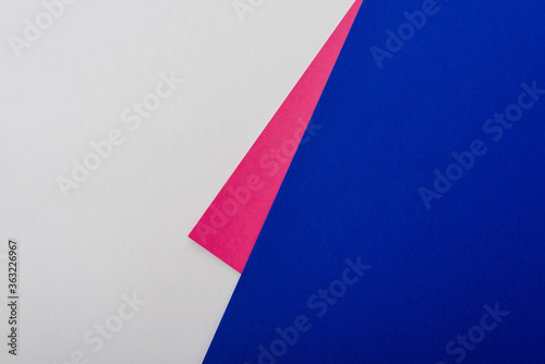 abstract geometric background with white, pink, blue paper