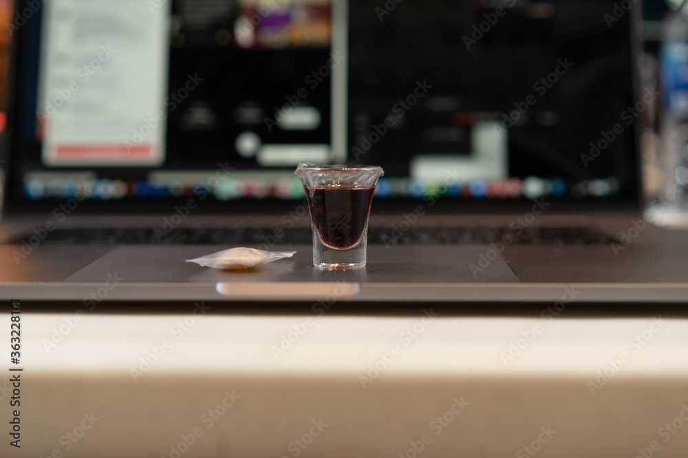 A Christian man is involved in holy communion by the online church at his house: Sunday service online.