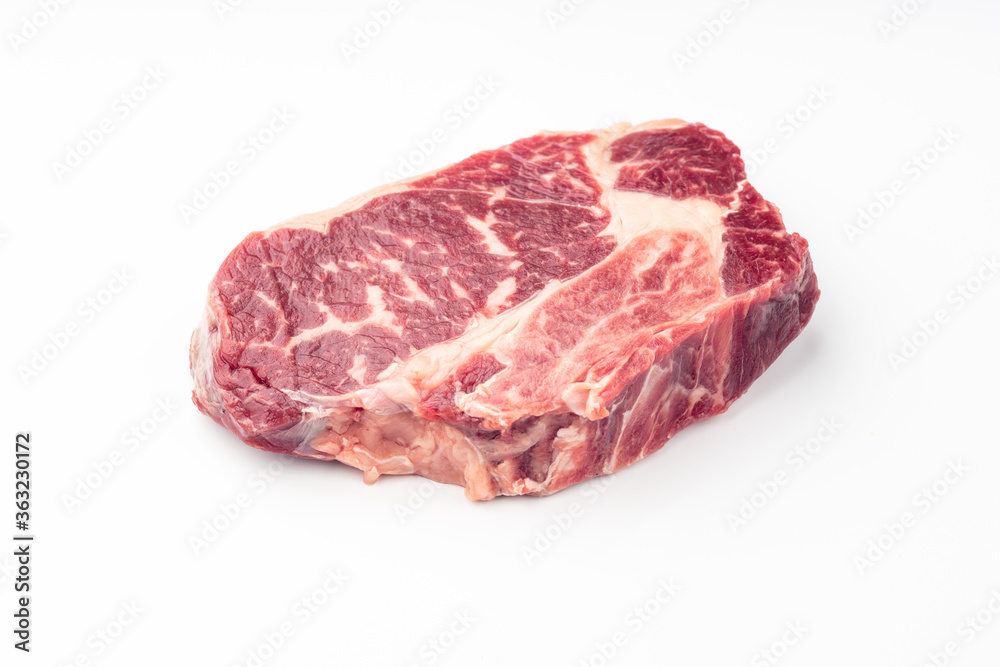 Fresh raw beef steak isolated on white background.