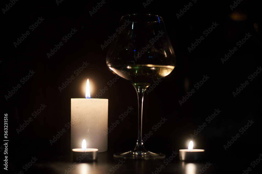 Candles and a glass of wine in the dark. Candles and a glass of wine in the dark.