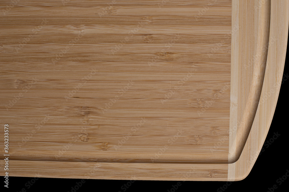 Wooden cutting board on a black background Wooden cutting board on a black background
