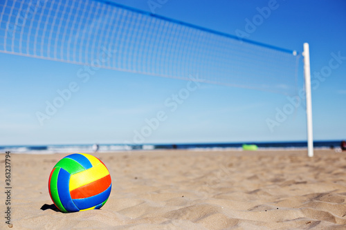 Beach Volleyball. Game ball on sand waiting for game. At the beach.