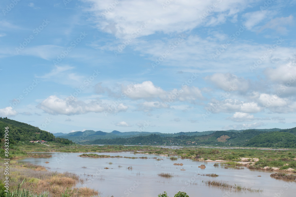 View of mountains, rivers, see rocks and blue sky. View of mountains, rivers, see rocks and blue sky.