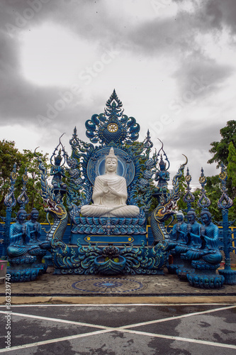 Wat Rong Suea Ten or The Blue Temple translates as House of the dancing tiger. A monumental  modern Buddhist temple distinguished by its vivid blue coloring   elaborate carvings in Chiang Rai Province