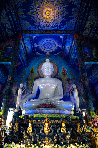 Wat Rong Suea Ten or The Blue Temple translates as House of the dancing tiger. A monumental, modern Buddhist temple distinguished by its vivid blue coloring & elaborate carvings in Chiang Rai Province