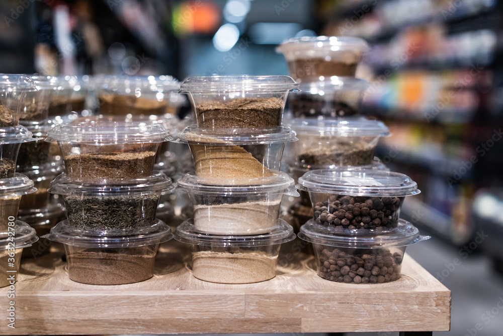 various spices and herbs packed in small transparent plastic boxes various spices and herbs packed in small transparent plastic boxes