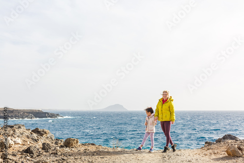 mother with little daughter travel in mountains tenerife