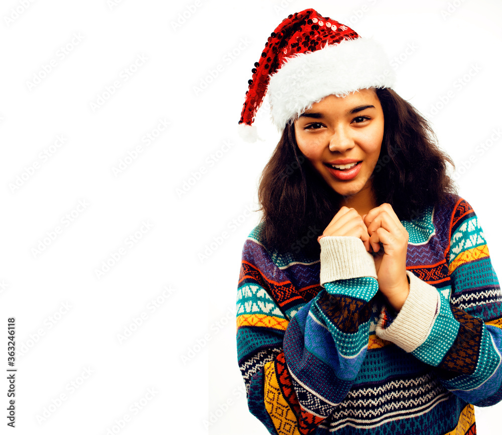 cute young real african hipster girl in santas red hat isolated on white background waiting for winter Christmass