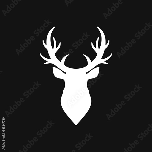 Elk head icon. Template logo design. Vector silhouette of deers head with antlers. Christmas symbol. Vector illustration. EPS 10