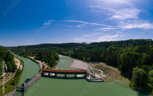 Isar river dam in southern Bavaria with fish stairs next to a beautiful forest at a beautiful day. photo