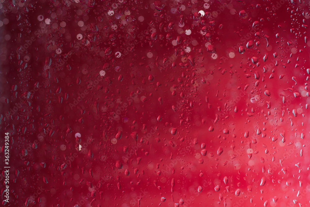 Red water drops background. Red water drops on a boat glass background.