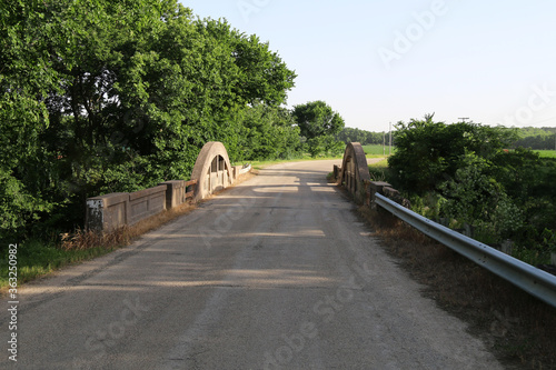 country river bridge farmland dirt road crossing