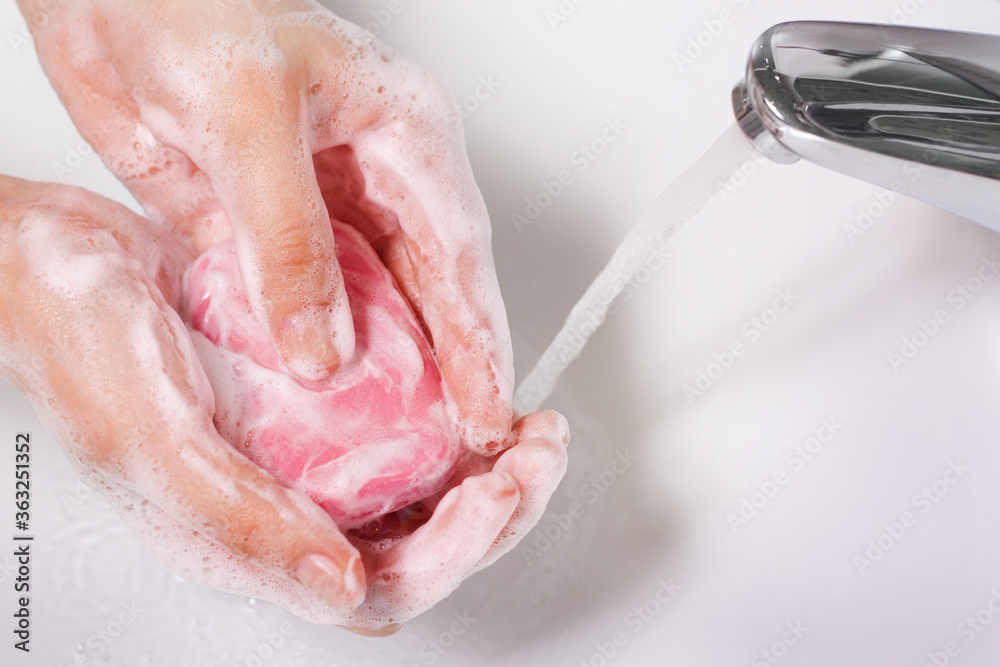 Washing of female hands with soap and water. The concept of disinfection, healthy lifestyle, hygiene, health and beauty. Washing of female hands with soap and water. The concept of disinfection, healthy lifestyle, hygiene, health and beauty.