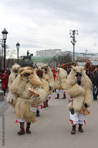 Moscow Maslenitsa Festival 2020. Traditional national celebration in folk style. Slavic tradition. Performance with Hungarian masked artists. Buso from Hungary. Busojaras holiday in Moscow. Beast photo