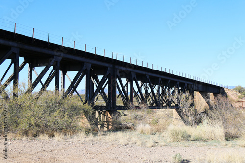 tall railway bridge desert gorge blue sky