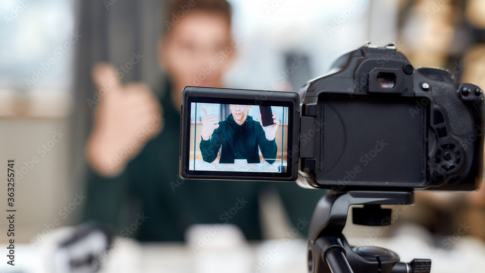 Close up of camera screen. Male technology blogger recording video blog or vlog review of new smartphone at home studio. Blogging, Work from Home concept Close up of camera screen. Male technology blogger recording video blog or vlog review of new smartphone at home studio. Blogging, Work from Home concept