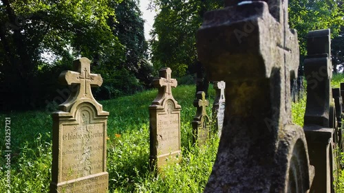 German 1st world war heroes cemetery in an old village Hungary / Europe. Walk among the religious tombstones, graves, graveyards. Old vintage Christian Cemetery. 4k Daytime slow motion shot