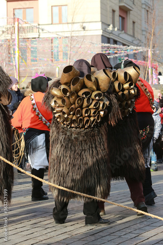 Moscow Maslenitsa Festival . Traditional celebration in folk style. Sardinian masked artists: mamuthones, isohadores from Sardinia, Italy. Ethnic clothes, costumes photo