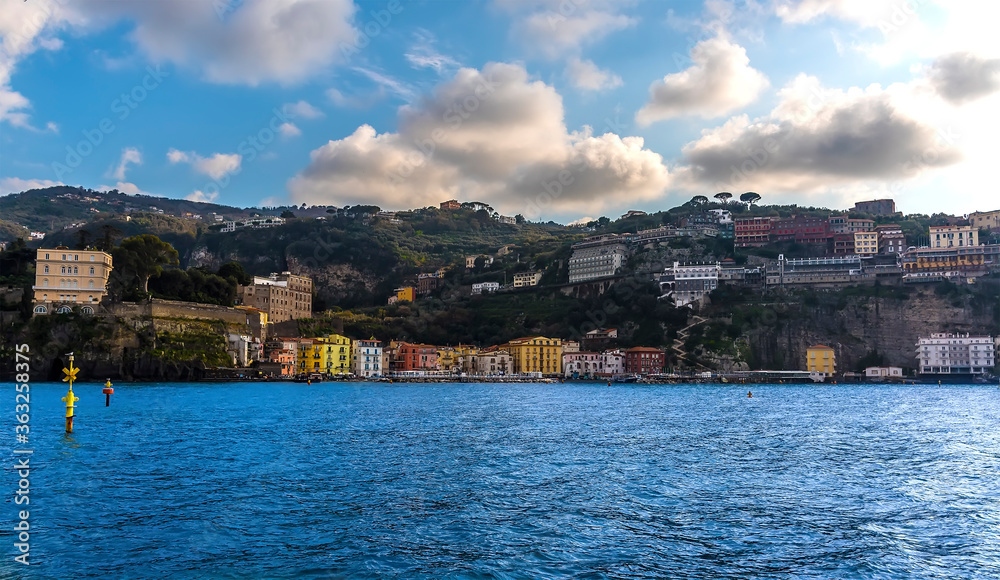 Sailing towards the old harbour at Marina Grande in Sorrento, Italy on a bright spring evening